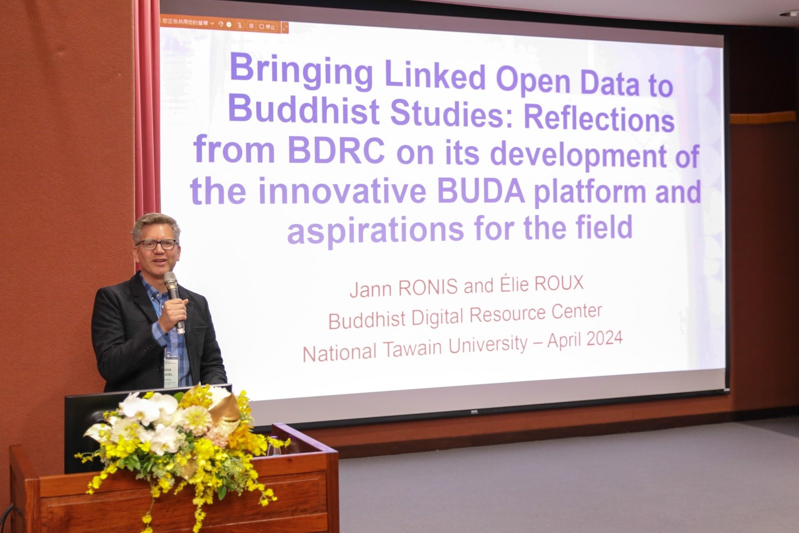 Jann Ronis speaking at the 2023 Aming Tu Prize award lecture